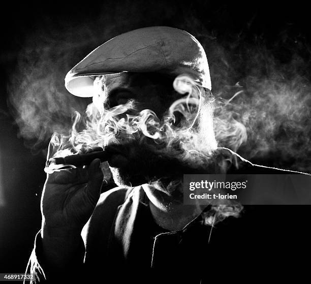 cool man smoking cigar i the night. - cigar smokers stock pictures, royalty-free photos & images