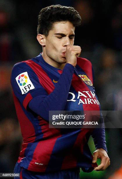 Barcelona's defender Marc Bartra celebrates a goal during the Spanish league football match FC Barcelona v UD Almeria at the Camp Nou stadium in...