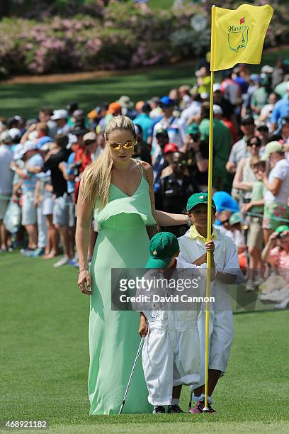 Tiger Woods' girlfriend Lindsey Vonn, son Charlie and daughter Sam watch the play during the Par 3 Contest prior to the start of the 2015 Masters...