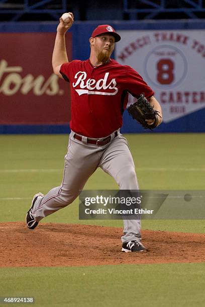 Nate Adcock of the Cincinnati Reds pitches during the exhibition game against the Toronto Blue Jays at Olympic Stadium on Friday, April 3, 2015 in...