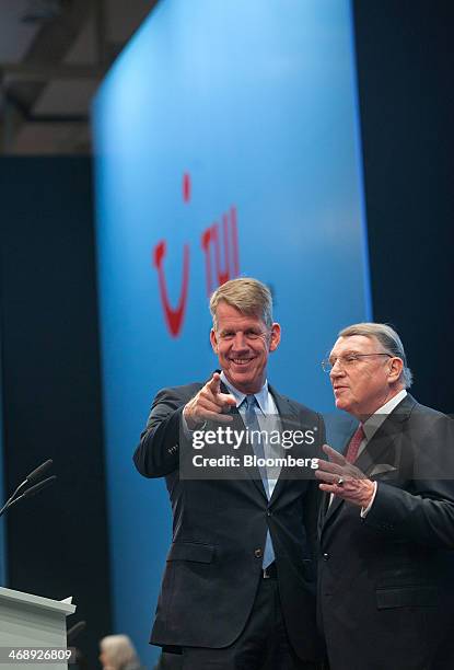 Friedrich Joussen, chief executive officer of TUI AG, left, poses for a photograph beside Klaus Mangold, chairman of TUI AG, before the company...