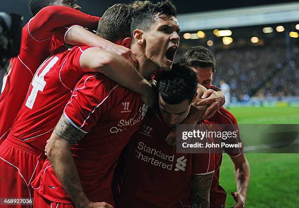 Philippe Coutinho of Liverpool celebrates with teammates after scoring during the FA Cup Quarter Final Replay match between Blackburn Rovers and...