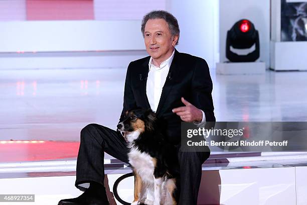 Presenter of the show Michel Drucker and his dog attend the 'Vivement Dimanche' French TV Show at Pavillon Gabriel on April 8, 2015 in Paris, France.