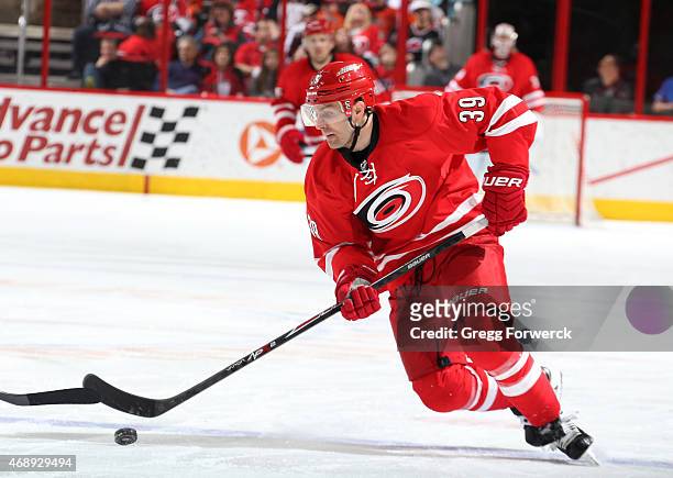 Patrick Dwyer of the Carolina Hurricanes attempts to gain control of a loose puck during their NHL game against the Philadelphia Flyers at PNC Arena...