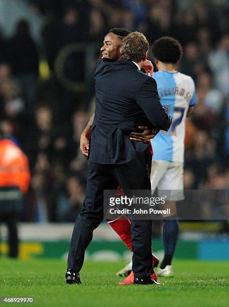 Brendan Rodgers manager and Raheem Sterling of Liverpool celebrate at the end of the FA Cup Quarter Final Replay match between Blackburn Rovers and...