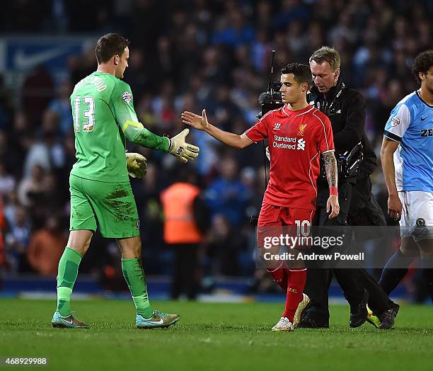 Simon Eastwood of Blackburn Rover and Philippe Coutinho of Liverpool shake hands at the end of the FA Cup Quarter Final Replay match between...