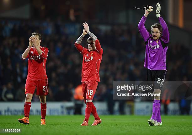 Alberto Moreno, Simon Mignolet and Lucas Leiva of Liverpool shows their appreciation to the fans at the end of the FA Cup Quarter Final Replay match...