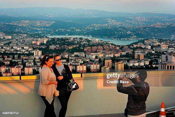 October 6 Isbank Tower 1, Levent District, Istanbul, Turkey. Tourists take photos on the rooftop of the Isbank Tower 1, overlooking the city of...