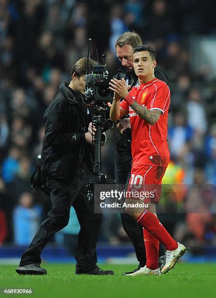 Player Philippe Coutinho of Liverpool applauds the Liverpool supporters after his goal during the FA Cup Quarter Final Replay match between Blackburn...