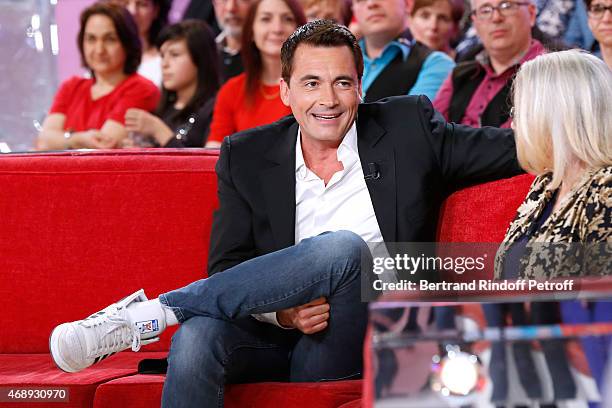 Host Olivier Minne and Actress Josiane Balasko attend the 'Vivement Dimanche' French TV Show at Pavillon Gabriel on April 8, 2015 in Paris, France.