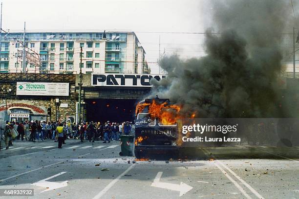 Anti-G8 protestes attack and burn a Carabinieri police armored vehicle on the first day of the G8 Summit on July 20, 2001 in Genoa, Italy. Thousands...