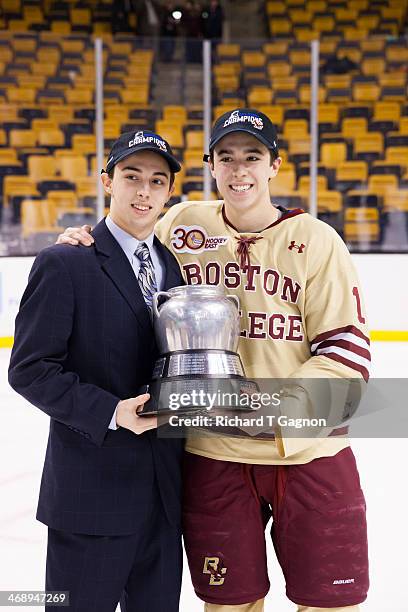 Brothers Johnny Gaudreau and Matthew Gaudreau of the Boston College Eagles celebrate after the Eagles beat the Northeastern University Huskies to win...