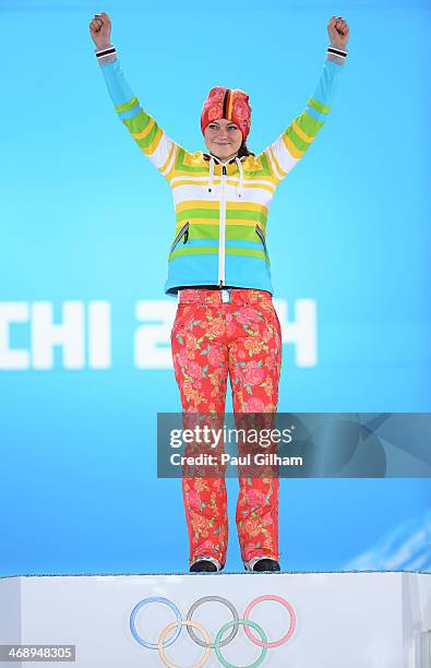 Gold medalist Carina Vogt of Germany celebrates during the medal ceremony for the Ladies' Normal Hill Individual on day five of the Sochi 2014 Winter...