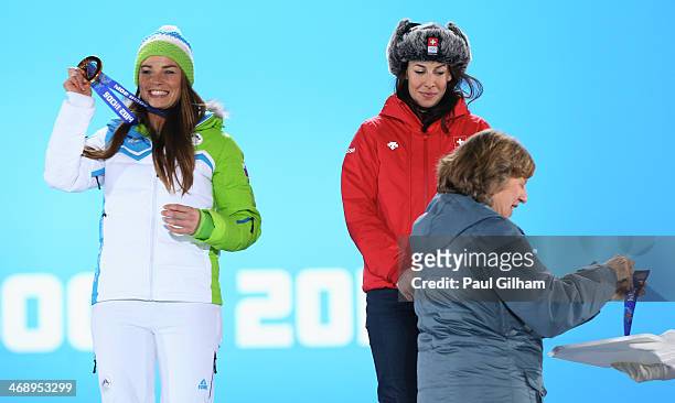 Joint gold medalists Tina Maze of Slovenia and Dominique Gisin of Switzerland celebrate on the podium during the medal ceremony for the for the...