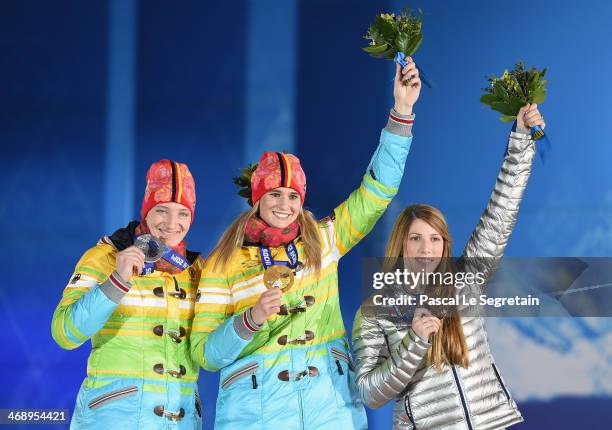 Silver medalist Tatjana Huefner of Germany, gold medalist Natalie Geisenberger of Germany and bronze medalist Erin Hamlin of the United States...