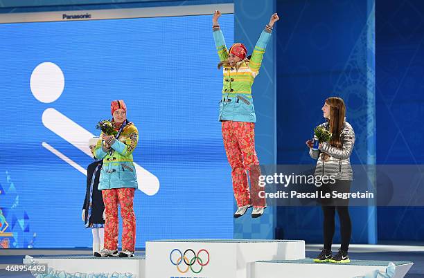 Silver medalist Tatjana Huefner of Germany, gold medalist Natalie Geisenberger of Germany and bronze medalist Erin Hamlin of the United States...