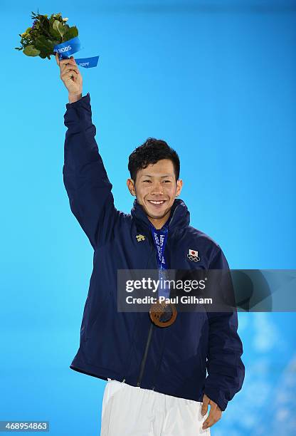 Bronze medalist Taku Hiraoka of Japan celebrates during the medal ceremony for the Snowboard Men's Halfpipe on day five of the Sochi 2014 Winter...