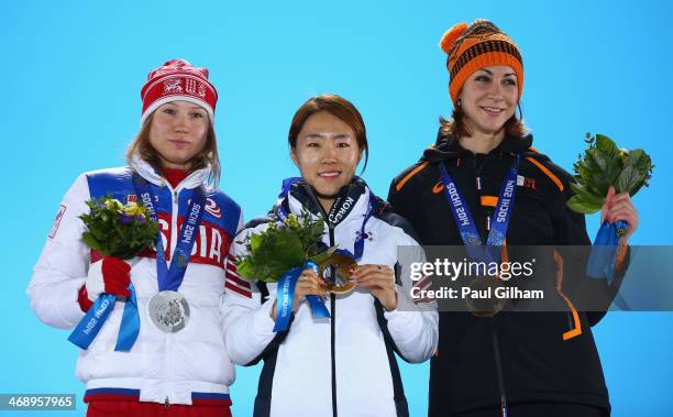 Silver medalist Olga Fatkulina of Russia, gold medalist Sang Hwa Lee of South Korea and bronze medalist Margot Boer of the Netherlands celebrate on...