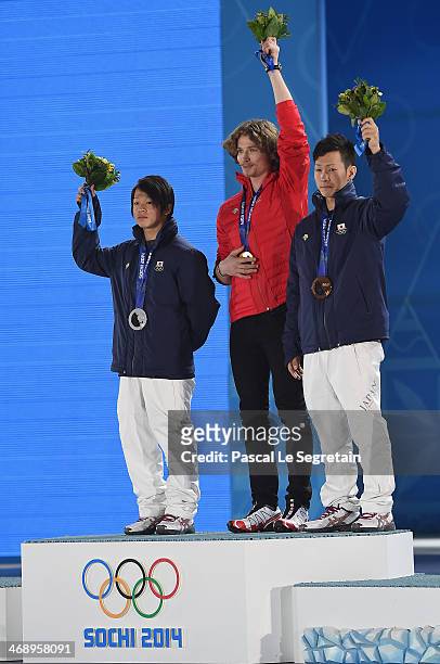 Silver medalist Ayumu Hirano of Japan, gold medalist Iouri Podladtchikov of Switzerland and bronze medalist Taku Hiraoka of Japan celebrate on the...