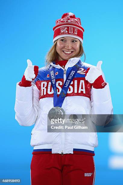 Silver medalist Olga Fatkulina of Russia celebrates during the medal for the Women's 500m on day five of the Sochi 2014 Winter Olympics at Medals...
