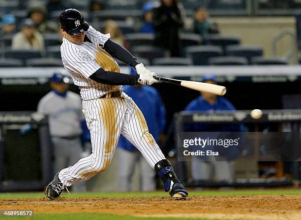 Chase Headley of the New York Yankees hits an RBI single in the 8th inning against the Toronto Blue Jays on April 8, 2015 at Yankee Stadium in the...