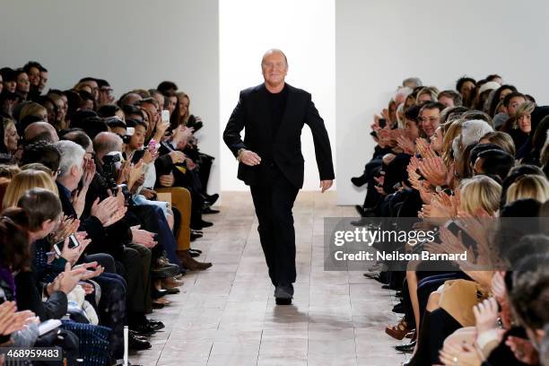Designer Michael Kors walks the runway at the Michael Kors fashion show during Mercedes-Benz Fashion Week Fall 2014 at Spring Studios on February 12,...