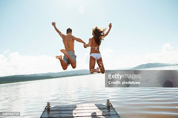 they have never felt more free! - men swimwear stock pictures, royalty-free photos & images