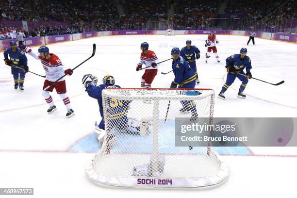 Patrik Elias of Czech Republic celebrates teammate Marek Zidlicky goal in the second period against Henrik Lundqvist of Sweden during the Men's Ice...