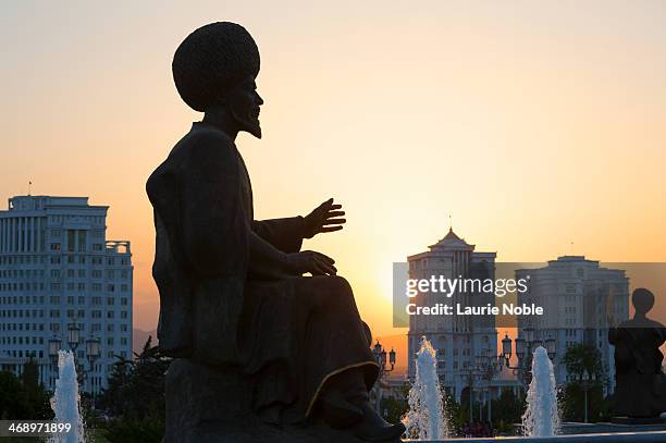 silhouette of statue at sunset, independence park - ashgabat turkmenistan fotografías e imágenes de stock