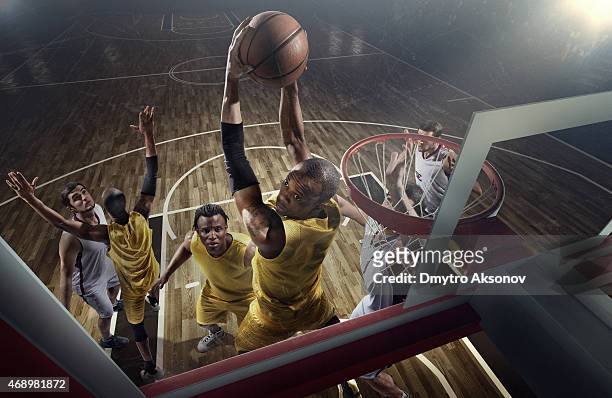 basketball game moments - slam dunk stock pictures, royalty-free photos & images