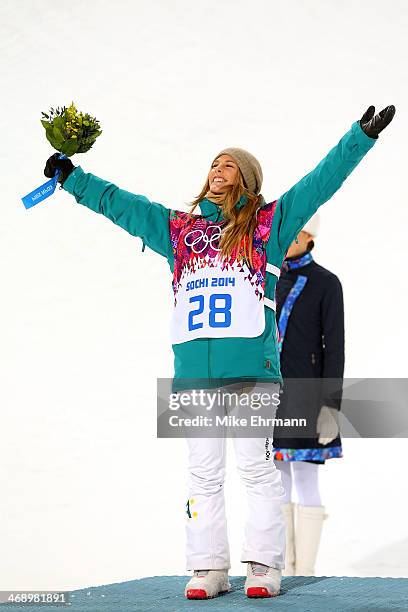 Silver medalist Torah Bright of Australia celebrates during the flower ceremony for the Snowboard Women's Halfpipe Finals on day five of the Sochi...