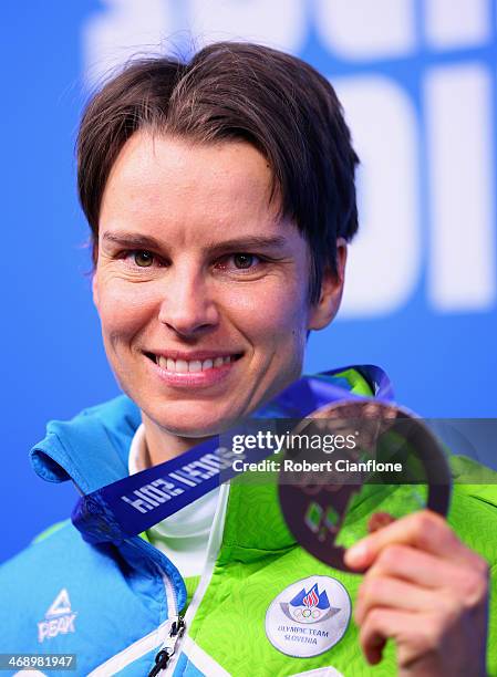 Bronze medalist Teja Gregorin of Slovenia celebrates during the medal ceremony for the Women's 10 km Pursuit on day five of the Sochi 2014 Winter...