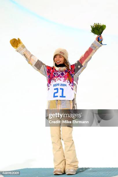 Gold medalist Kaitlyn Farrington of the United States celebrates during the flower ceremony for the Snowboard Women's Halfpipe Finals on day five of...