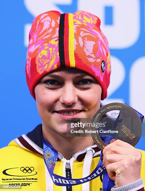 Gold medalist Carina Vogt of Germany celebrates during the medal ceremony for the Ladies' Normal Hill Individual on day five of the Sochi 2014 Winter...