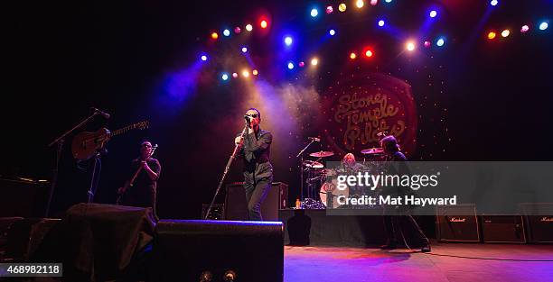 Robert DeLeo, Chester Bennington, Eric Kretz and Dean DeLeo of Stone Temple Pilots perform on stage during the opening night of the tour at The...