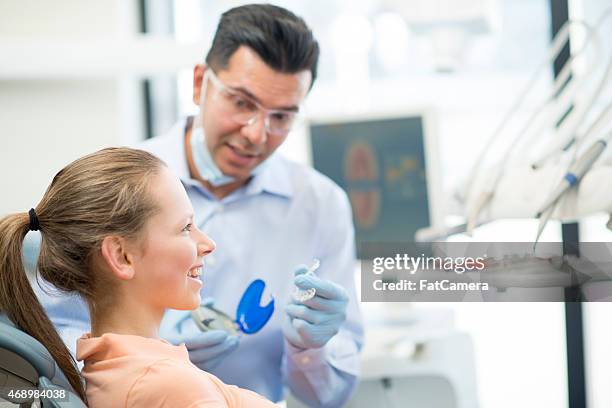 young female teenager getting invisalign - orthodontist stock pictures, royalty-free photos & images