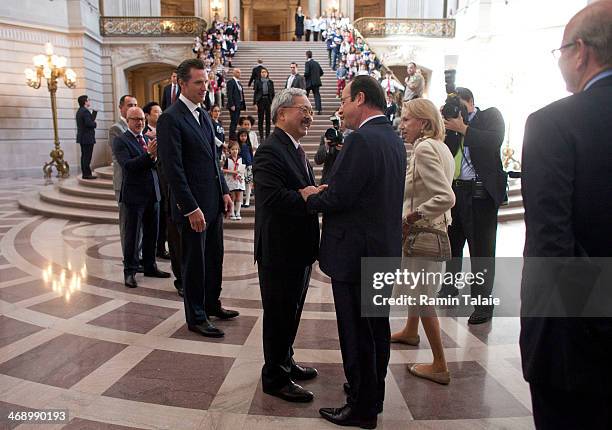 California Lieutenant Governor Gavin Newsom, and San Francisco Mayor Ed Lee, greet French President Francois Hollande during a visit to City Hall on...