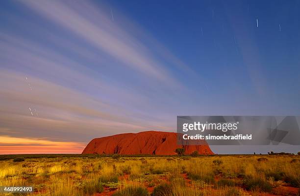 uluru by moonlight - uluru stock pictures, royalty-free photos & images