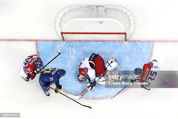 Alexander Salak of Czech Republic lays on the ice after a play at the net against Sweden during the Men's Ice Hockey Preliminary Round Group C game...
