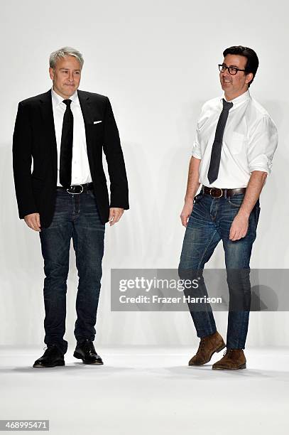 Designers Isaac Franco and Ken Kaufman walk the runway at the Kaufmanfranco fashion show during Mercedes-Benz Fashion Week Fall 2014 at The Theatre...