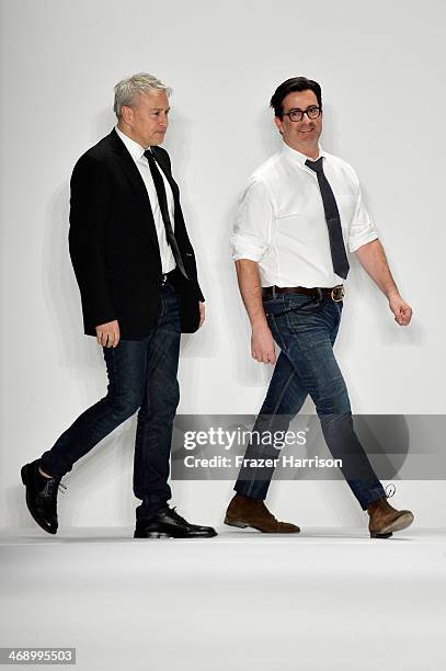Designers Isaac Franco and Ken Kaufman walk the runway at the Kaufmanfranco fashion show during Mercedes-Benz Fashion Week Fall 2014 at The Theatre...