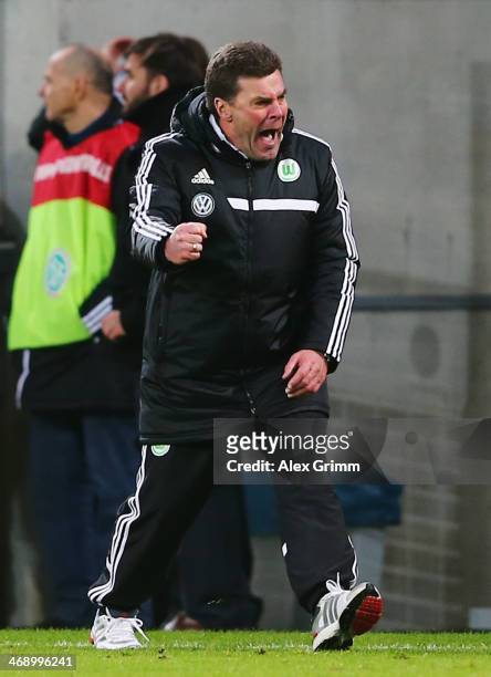 Head coach Dieter Hecking of Wolfsburg celebrates at the final whistle of the DFB Cup quarterfinal match between 1899 Hoffenheim and VfL Wolfsburg at...