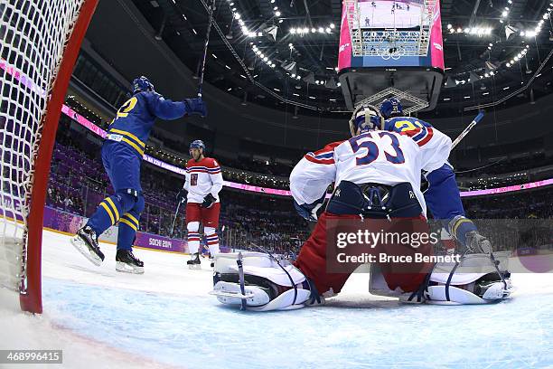 Erik Karlsson of Sweden scores a goal in the second period against Alexander Salak of Czech Republic during the Men's Ice Hockey Preliminary Round...