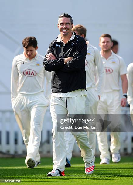 Kevin Pietersen of Surrey makes his way out for the team photo during the Surrey CCC photocall at The Kia Oval on April 09, 2015 in London, England.