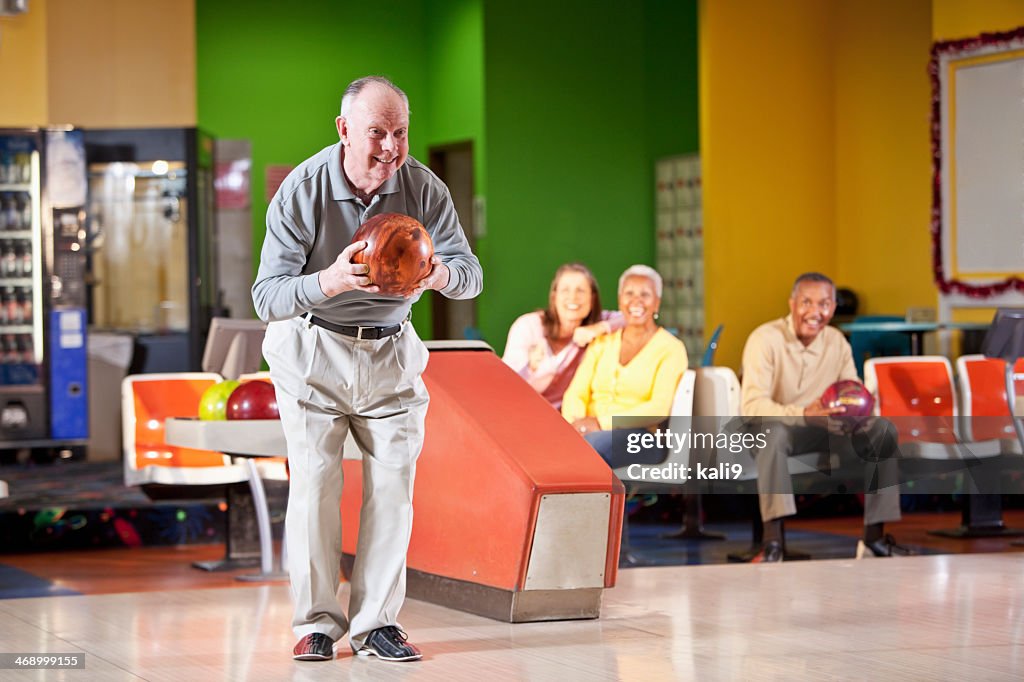 Senior man bowling