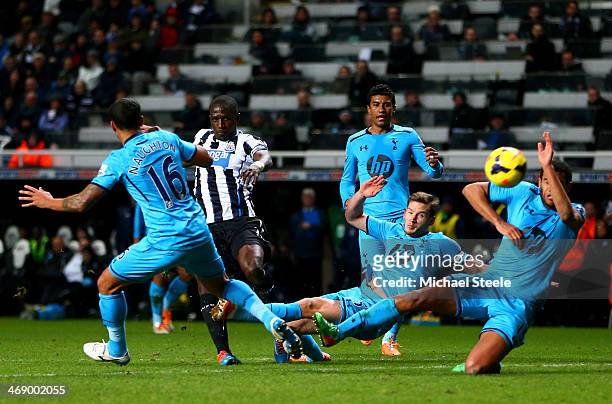 Moussa Sissoko of Newcastle United shoots past Jan Vertonghen of Tottenham Hotspur during the Barclays Premier League match between Newcastle United...