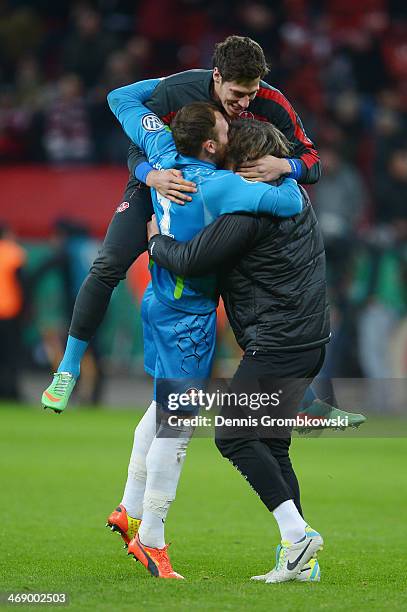 Kaiserslautern players celebrate after winning the DFB Cup quarterfinal match between Bayer Leverkusen and 1. FC Kaiserslautern at BayArena on...