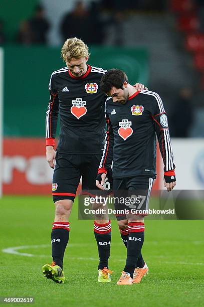 Simon Rolfes and Gonzalo Castro of Bayer Leverkusen look dejected after the DFB Cup quarterfinal match between Bayer Leverkusen and 1. FC...