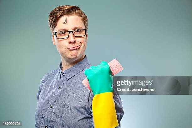 nerdy guy getting ready to clean - kids with cleaning rubber gloves 個照片及圖片檔