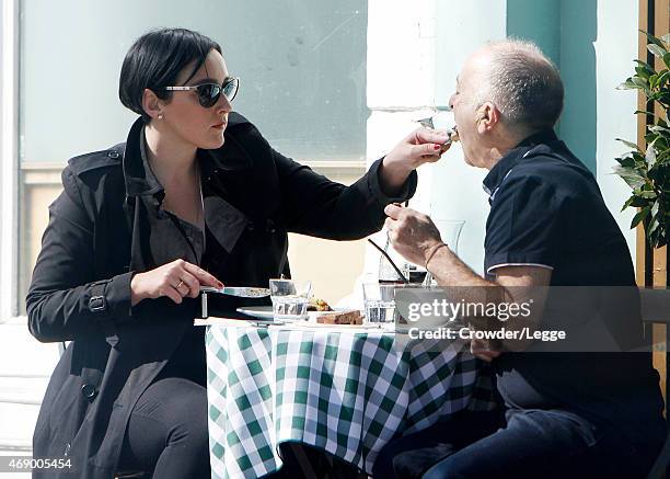 Tony Robinson and his wife Louise are pictured enjoying the sunshine with a spot of lunch in Primrose Hill on April 7, 2015 in London, England.